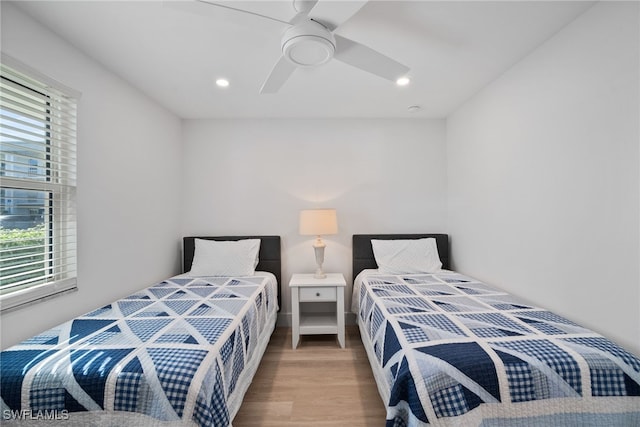 bedroom featuring hardwood / wood-style floors and ceiling fan