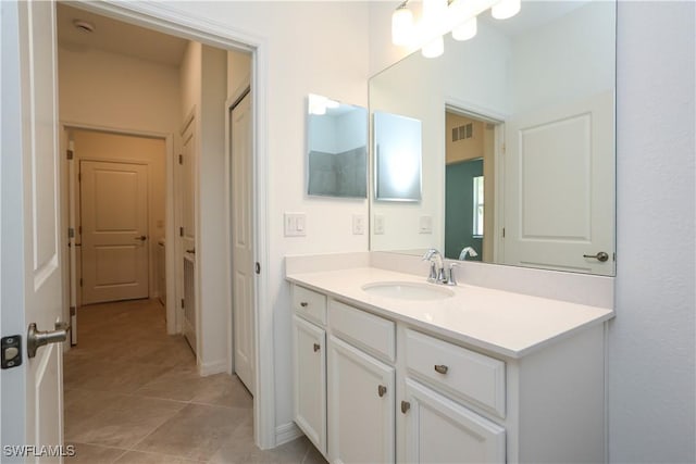 bathroom with tile patterned floors and vanity