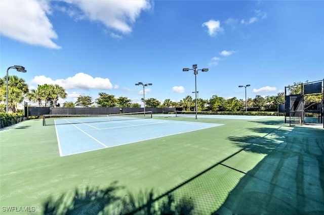 view of tennis court featuring basketball court