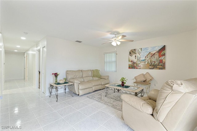 living room featuring ceiling fan and light tile patterned floors