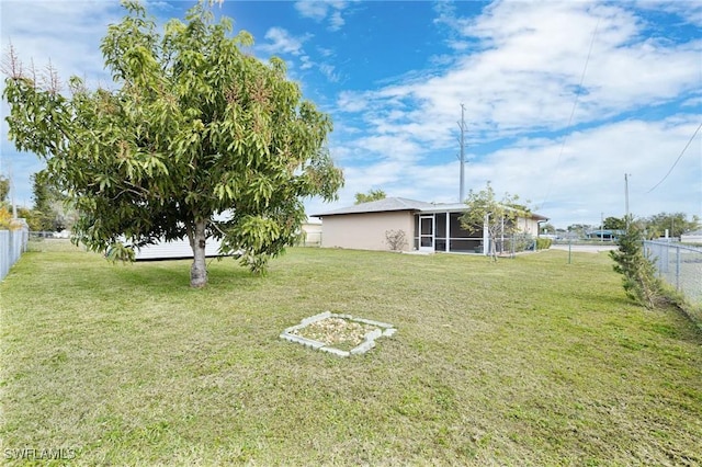 view of yard with a sunroom