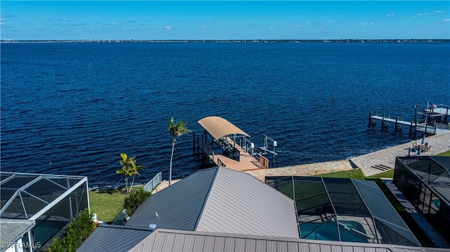 dock area with a water view and a lanai