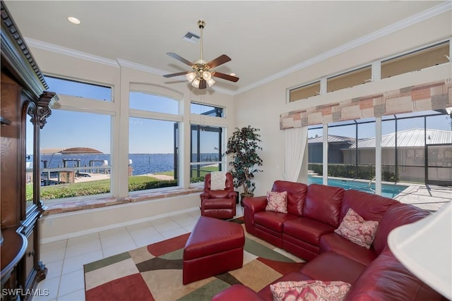 tiled living room with crown molding, a water view, and ceiling fan