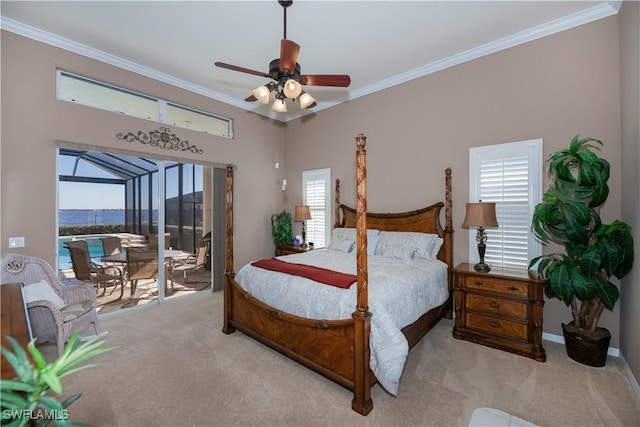 carpeted bedroom with access to outside, ornamental molding, and ceiling fan