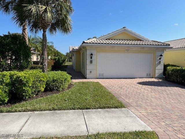 view of front of property with a garage