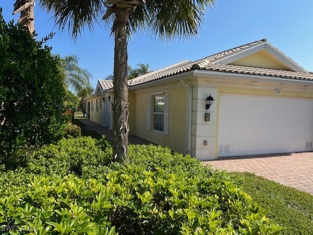 view of property exterior with a garage