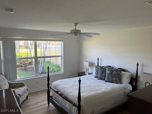 bedroom featuring ceiling fan and hardwood / wood-style floors