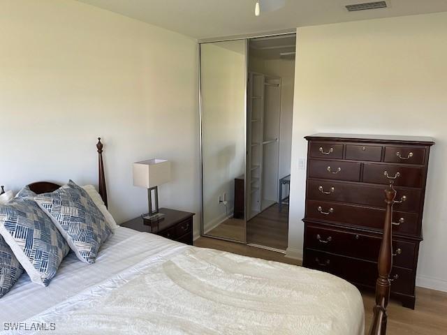 bedroom featuring light hardwood / wood-style floors and a closet