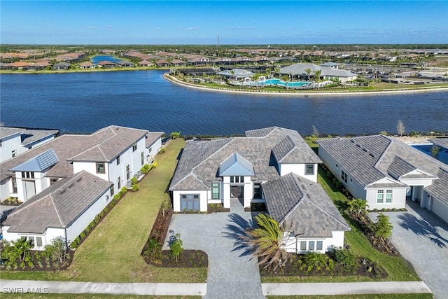 birds eye view of property featuring a water view