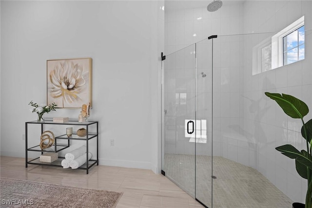 bathroom with tile patterned floors and a shower with shower door