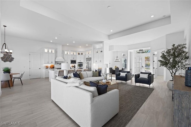 living room featuring an inviting chandelier