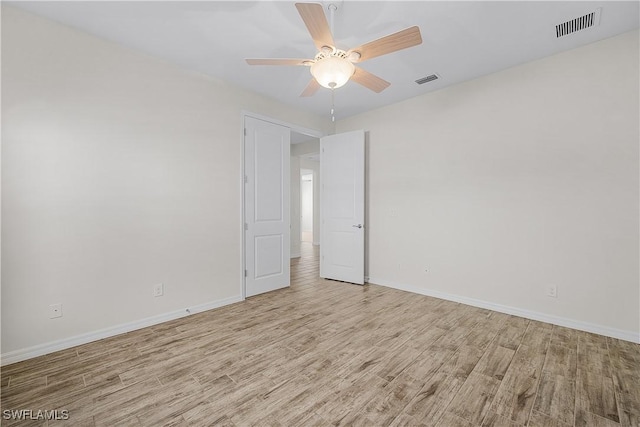 unfurnished room featuring ceiling fan and light hardwood / wood-style flooring