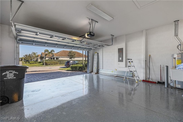 garage with electric panel and a garage door opener