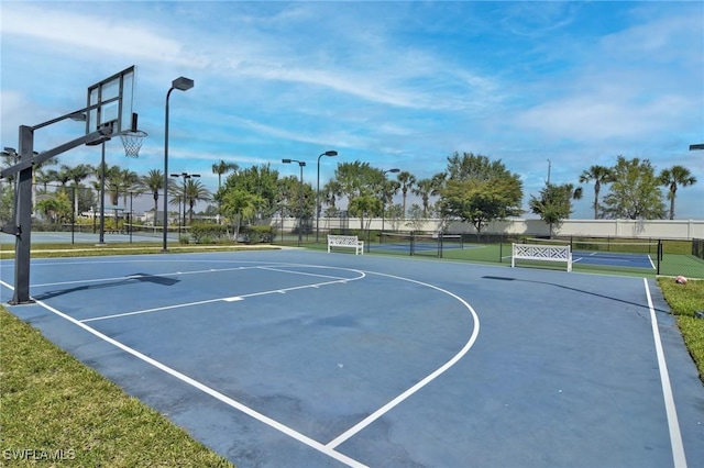 view of sport court featuring tennis court