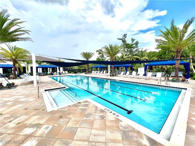 view of swimming pool featuring a patio