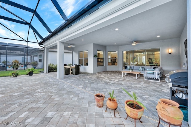 view of patio / terrace with an outdoor hangout area, ceiling fan, and a lanai