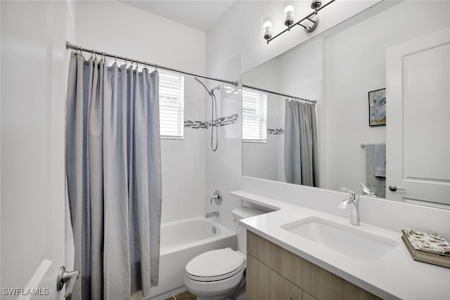 full bathroom featuring toilet, shower / bath combination with curtain, and vanity