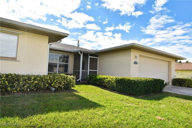 view of front facade with a garage and a front yard