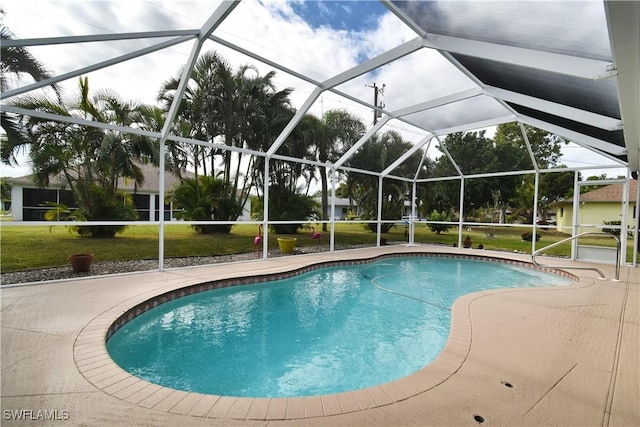 view of pool featuring a patio area, a lanai, and a lawn