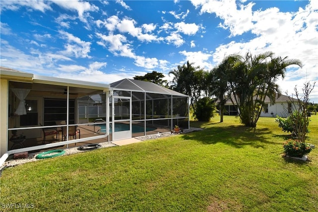 view of yard with a patio area and a lanai