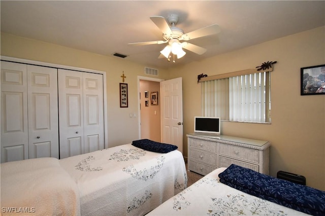 bedroom featuring ceiling fan and a closet