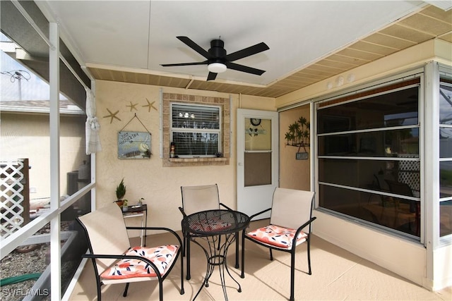 view of patio featuring ceiling fan