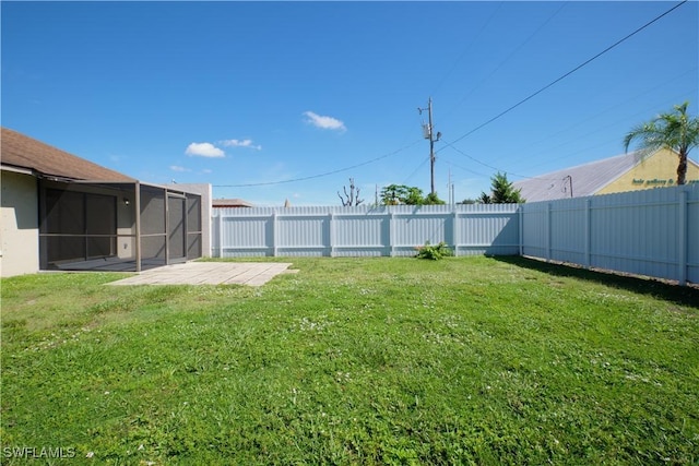 view of yard featuring a sunroom