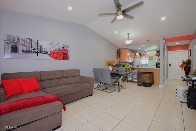 tiled living room with ceiling fan and lofted ceiling