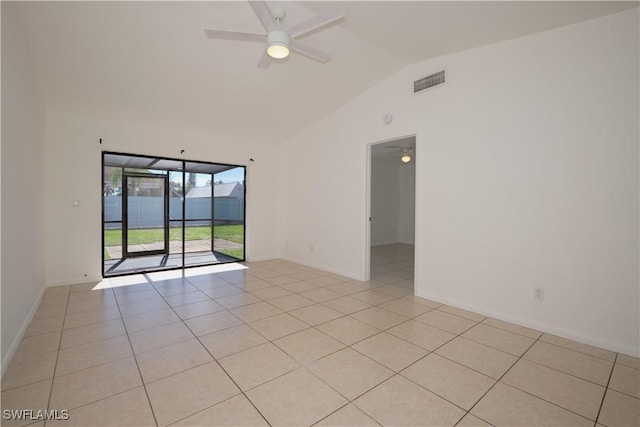 tiled spare room with ceiling fan and lofted ceiling