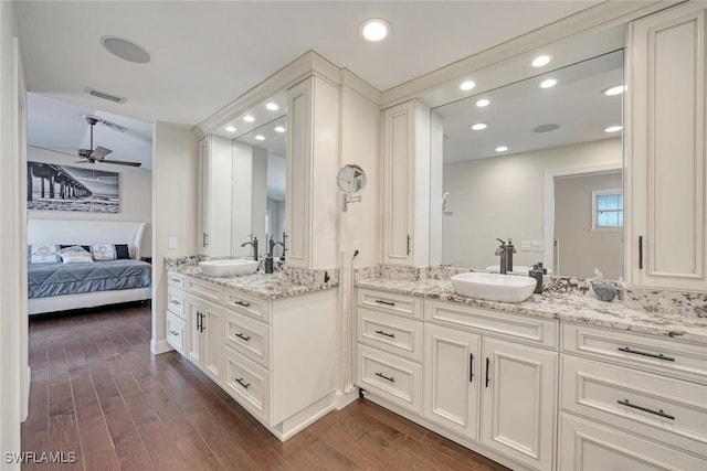 bathroom featuring ceiling fan, vanity, and hardwood / wood-style floors