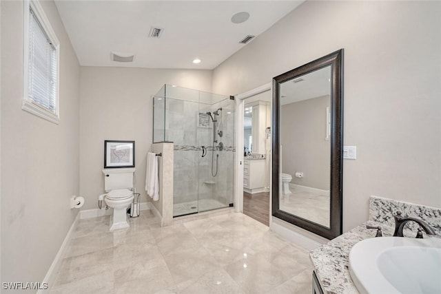 full bathroom with toilet, vanity, and separate shower and tub