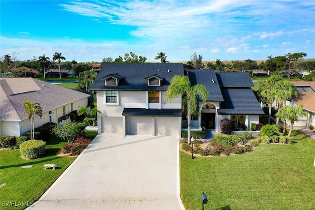 14565 Eagle Ridge Dr, Fort Myers, FL 33912 - view of front of property with a front yard and a garage