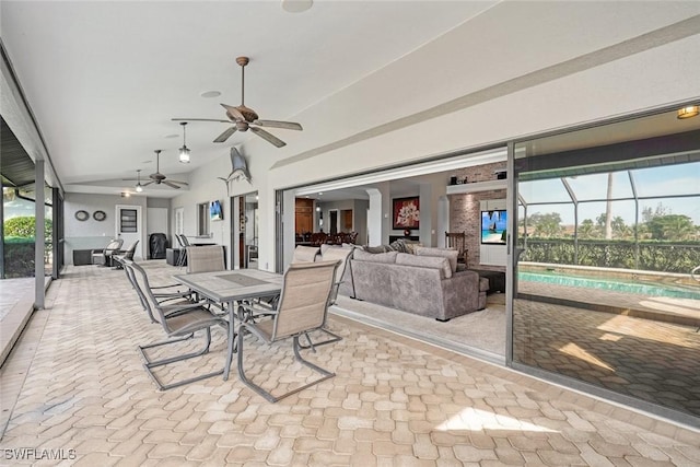 interior space featuring ceiling fan and a healthy amount of sunlight