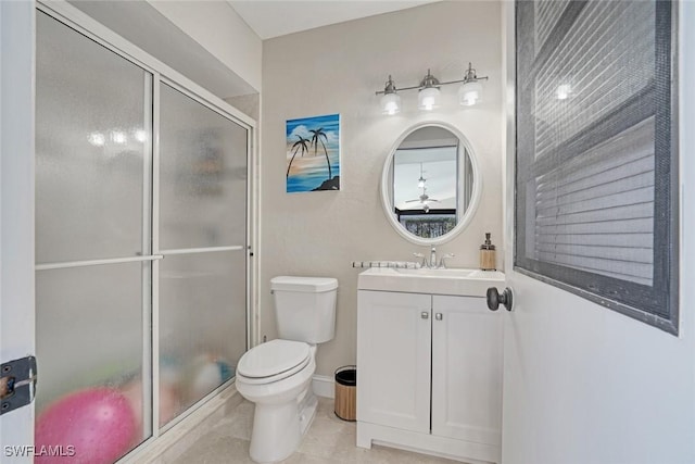 bathroom with toilet, walk in shower, vanity, and tile patterned flooring