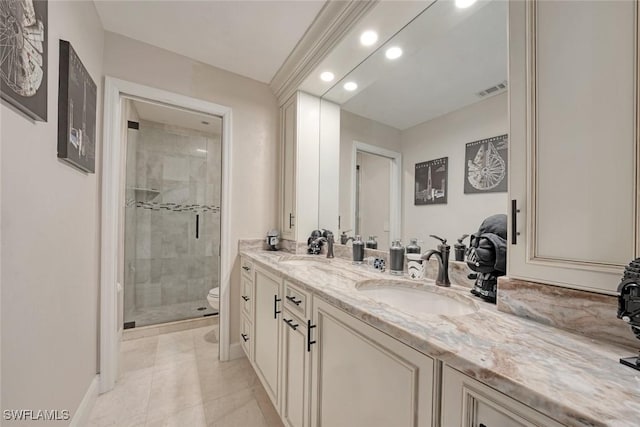 bathroom featuring tile patterned flooring, toilet, walk in shower, and vanity