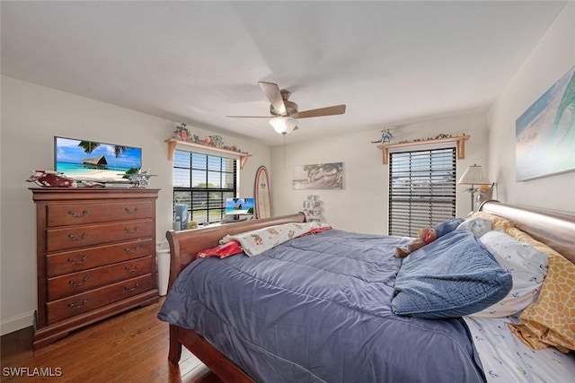 bedroom featuring ceiling fan and hardwood / wood-style flooring