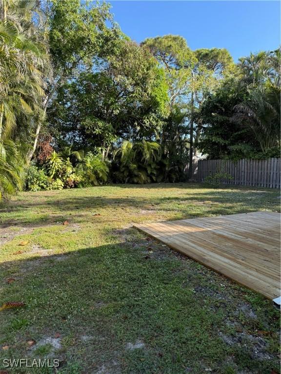 view of yard with a wooden deck