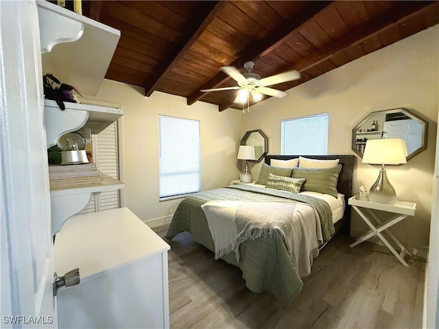 bedroom featuring wood ceiling, multiple windows, ceiling fan, and light hardwood / wood-style flooring