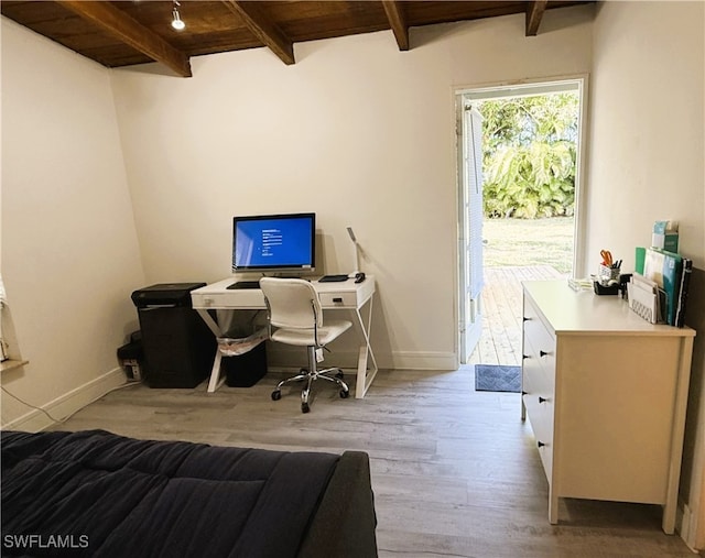 office area with wood ceiling, beam ceiling, and light hardwood / wood-style floors