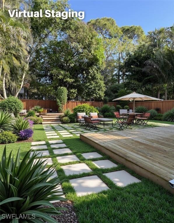 view of yard with a wooden deck