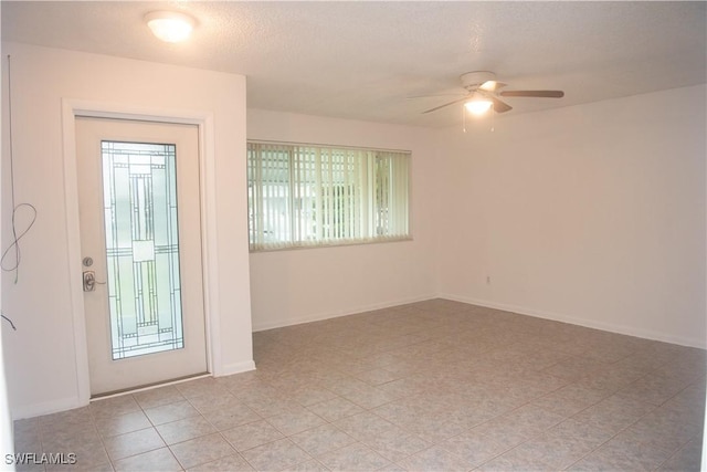 entryway featuring ceiling fan