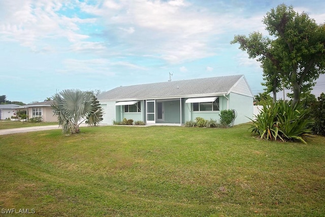 view of front of property with a front lawn