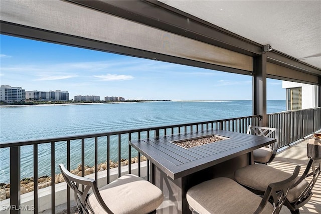 balcony featuring a water view