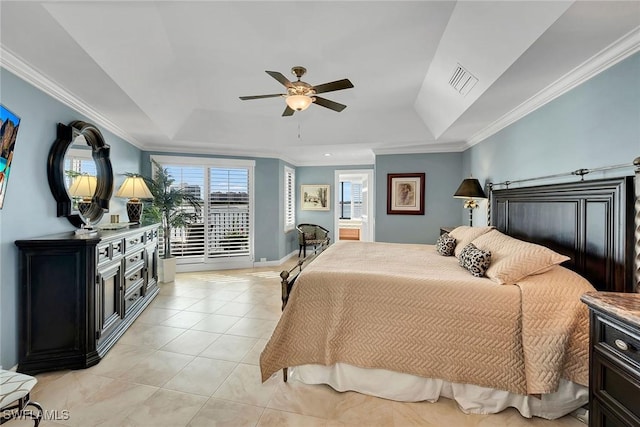 tiled bedroom featuring a tray ceiling, ceiling fan, and ornamental molding