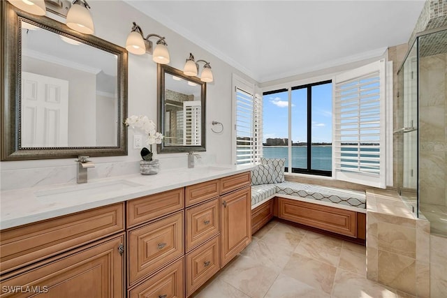 bathroom with vanity, a water view, and ornamental molding