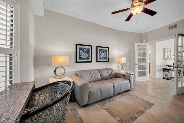 living room featuring crown molding, french doors, and ceiling fan