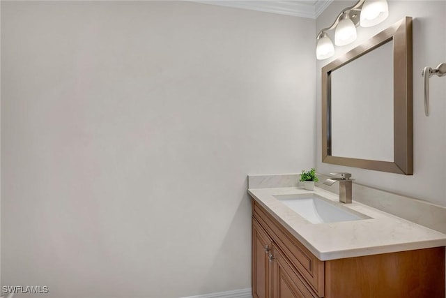 bathroom with vanity and ornamental molding