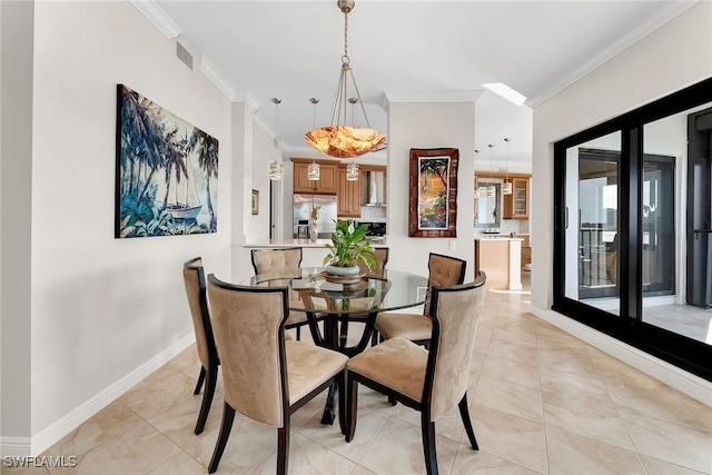 dining room featuring crown molding