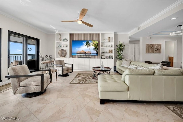 living room with built in shelves, ceiling fan, and ornamental molding