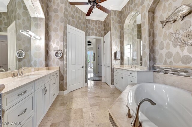 bathroom featuring ceiling fan, crown molding, a washtub, and vanity